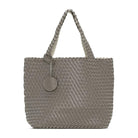 Gray woven handbag with a circular tag on a white background