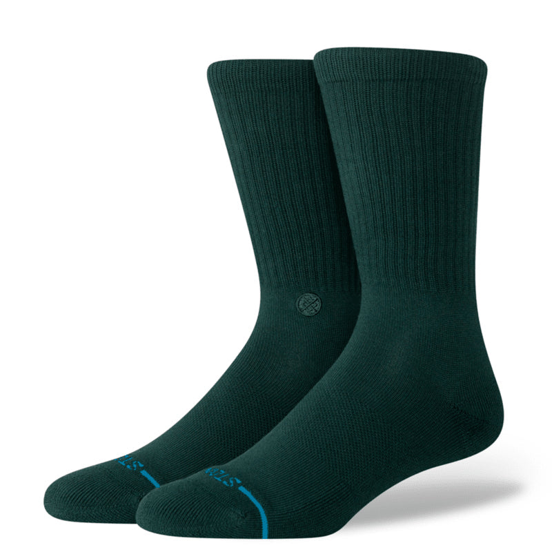 Pair of dark green socks on a white background